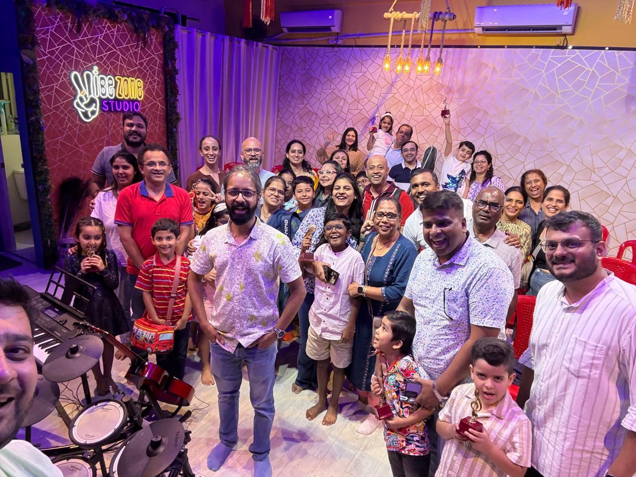 Students, families and instructors gathered together in the studio
